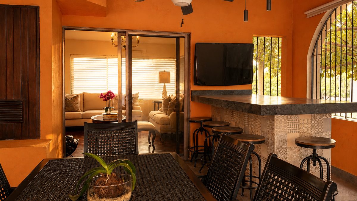 Terraza con asador y barra de servicio